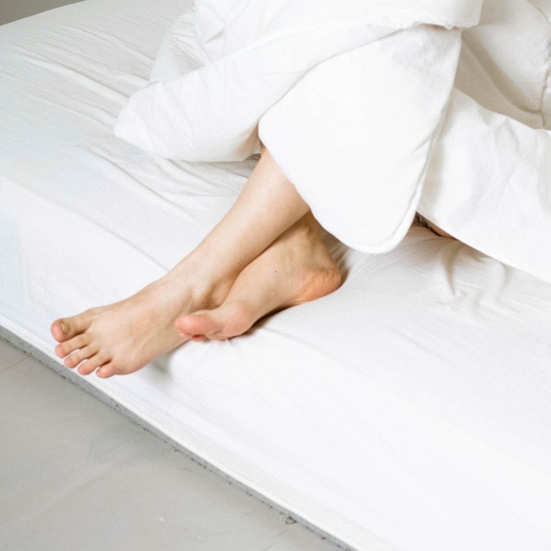 Persoon op Auping matras